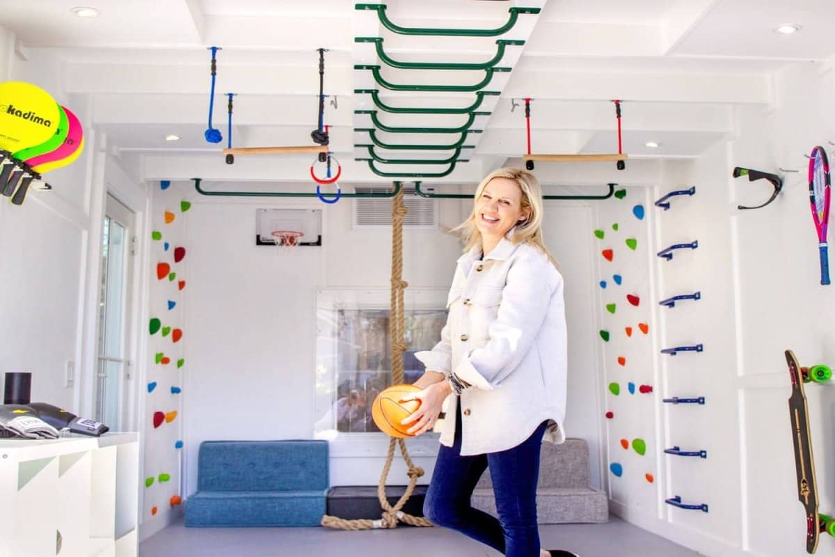 Bright playroom design consultation showcasing climbing holds and workout equipment for active play