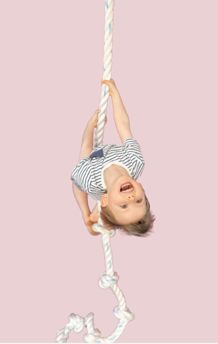 Bright educational playroom essentials with climbing equipment and a child exploring a fun environment