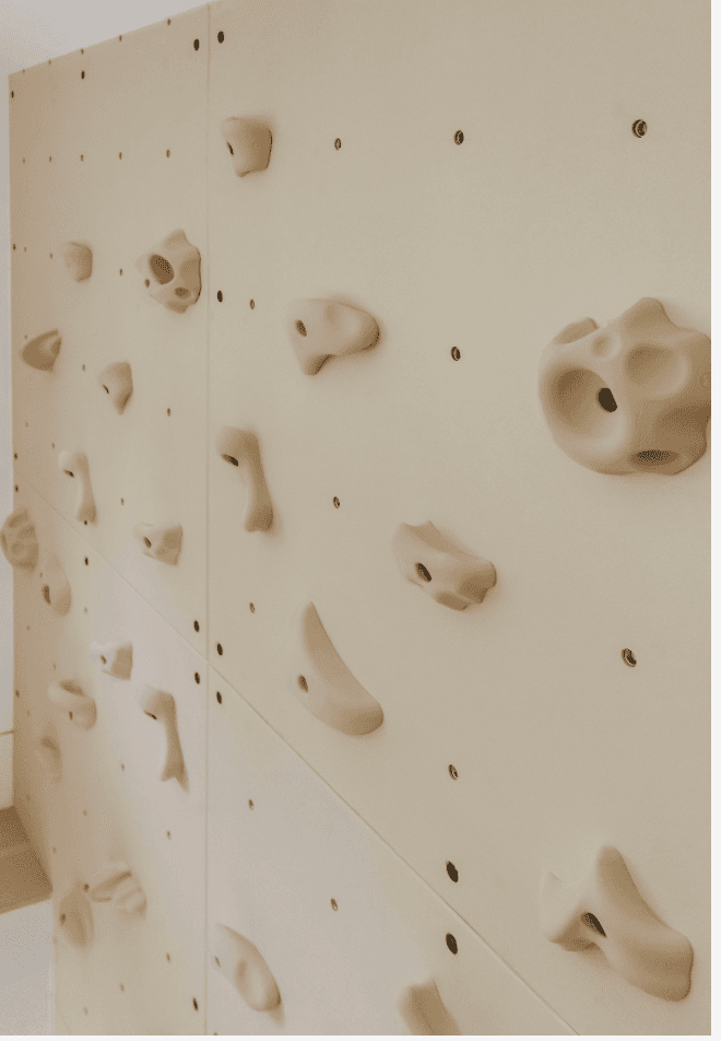 JZN designer rock wall holds for playroom mounted on a smooth wall for climbing fun