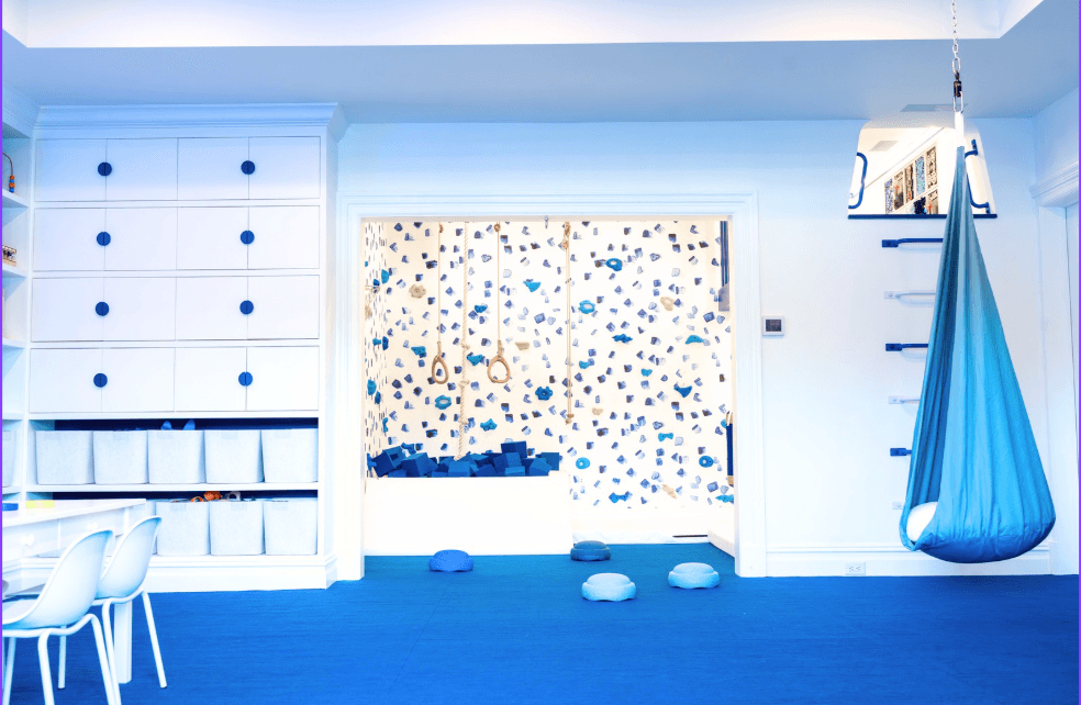 Dollamur carpet texture floor mat for playroom in a bright blue-themed playroom