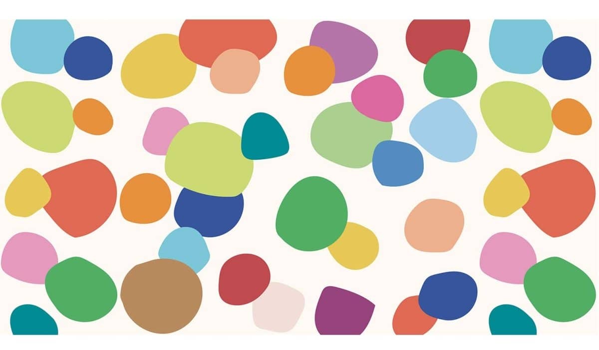 Colorful dots wallpaper for playroom featuring vibrant shapes in various hues on a white background