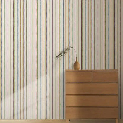 Colorful striped wallpaper for playrooms with vibrant vertical stripes against a white background