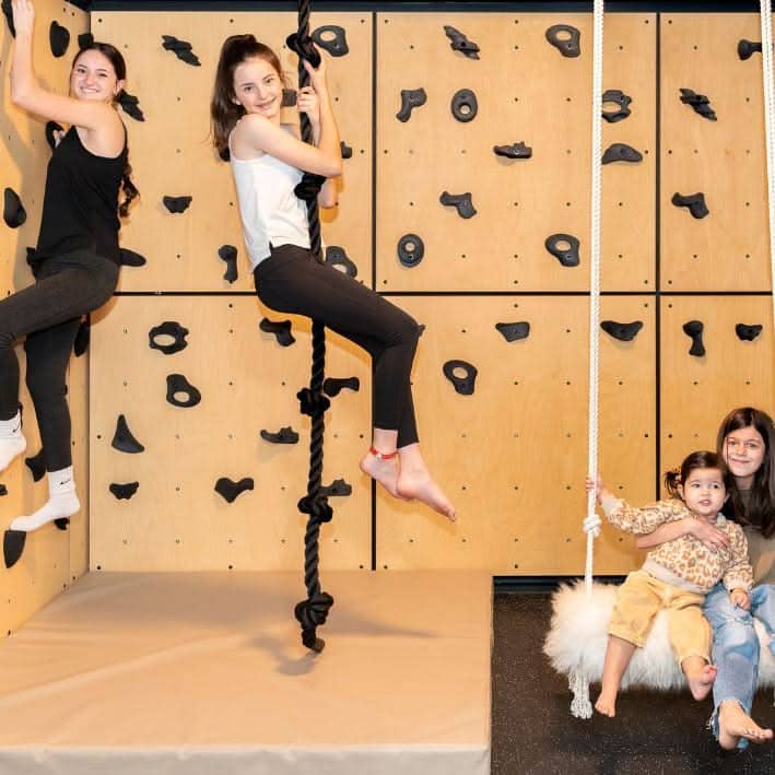 Kids enjoying the kids rock climbing wall panel for fun climbing activities and fitness