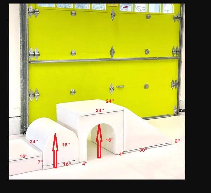 Large soft play shapes for kids in white, featuring tunnels and ramps for safe playtime activities