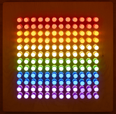 Lite-Brite peg set for kids creating colorful glowing patterns in a bright grid design