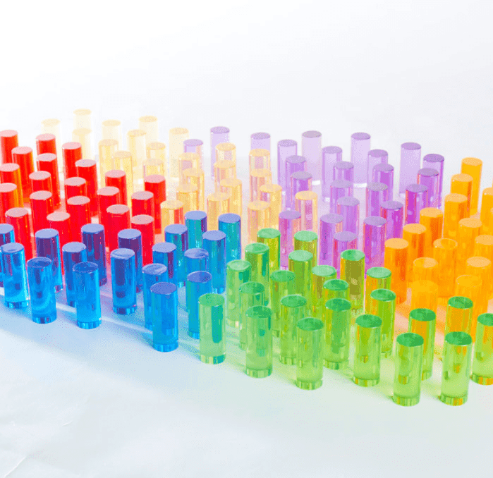 Colorful Lite-Brite peg set for kids arranged by shade for creative STEM activities