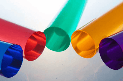 Colorful plastic tubes from the Lite-Brite peg set for kids in various shapes and colors