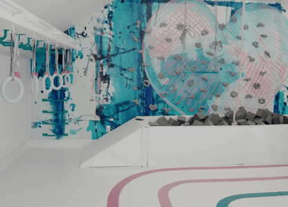 Colorful love heart wall mural creating a playful atmosphere in a children's gym