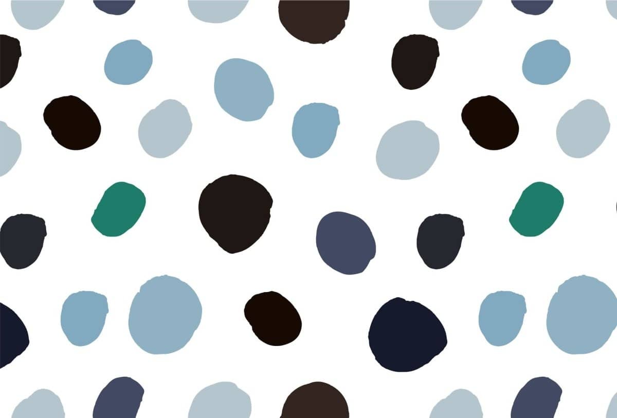 Cara Saven Montessori inspired wallpaper with colorful dots on a white background