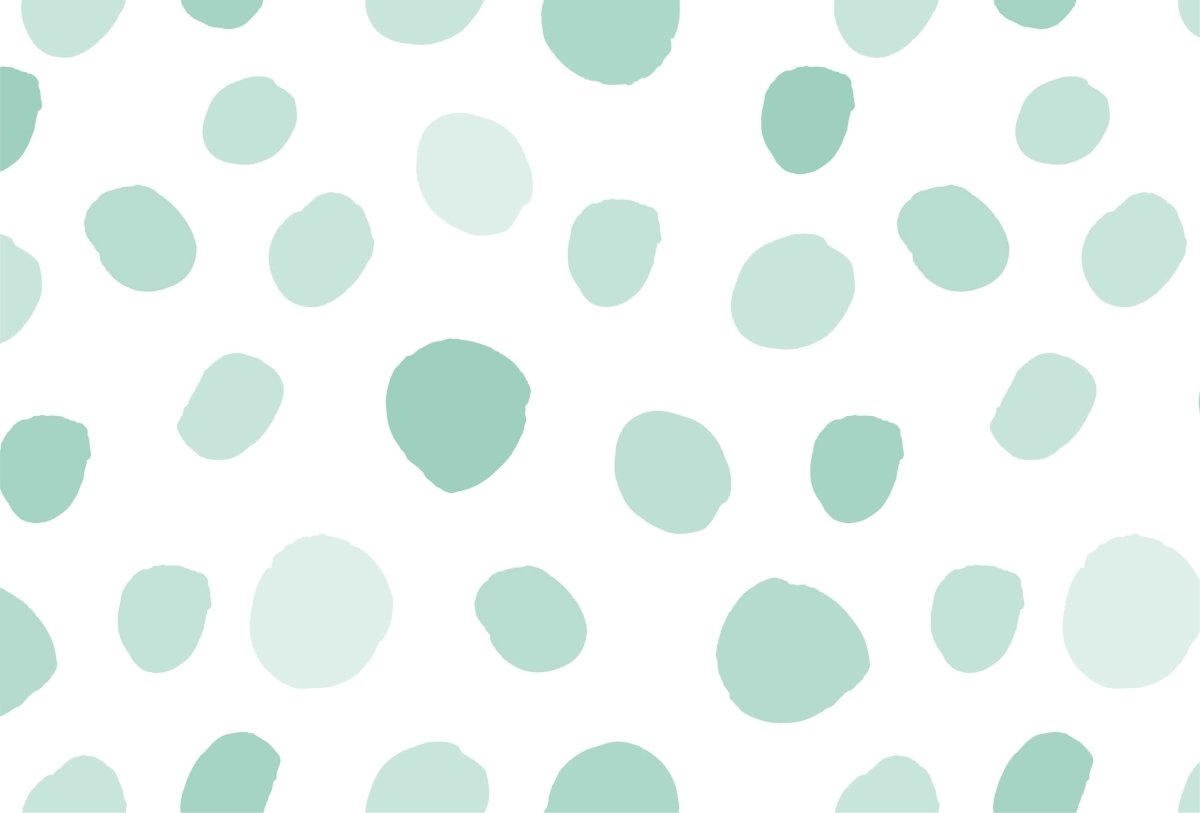 Cara Saven Montessori inspired wallpaper with soft green polka dot pattern on a white background