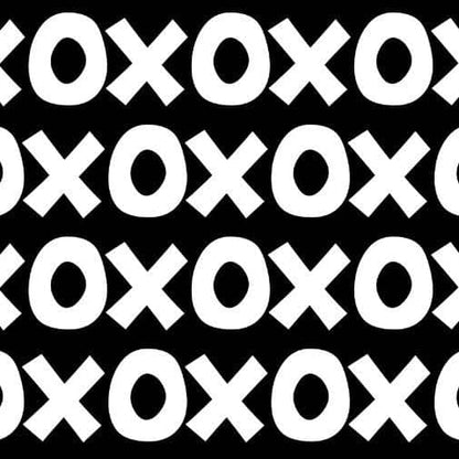 Montessori playroom wallpaper featuring a bold black and white pattern of circles and crosses