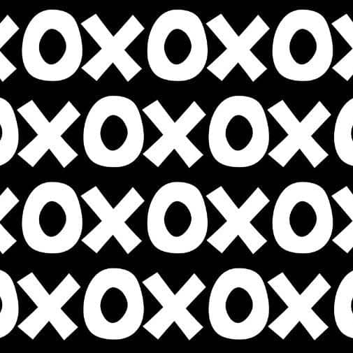 Montessori playroom wallpaper featuring a bold black and white pattern of circles and crosses