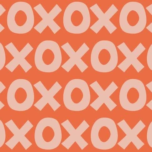 Montessori playroom wallpaper with bold XO pattern in warm orange and soft pink tones