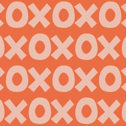 Montessori playroom wallpaper with bold XO pattern in warm orange and soft pink tones