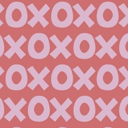 Montessori playroom wallpaper featuring a playful pattern of large pink and coral Xs and Os