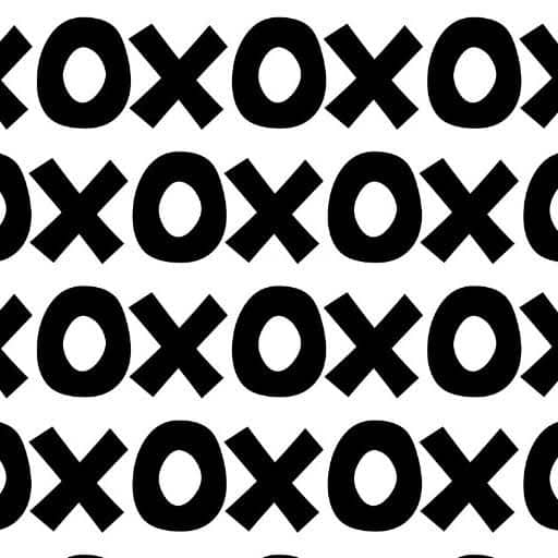 Black and white Montessori playroom wallpaper featuring a bold XOXO pattern