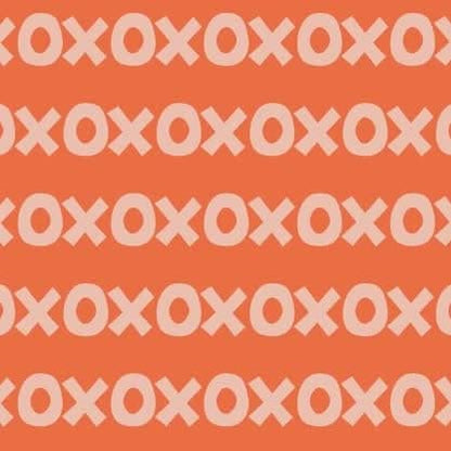 Sur La Mur Montessori wallpaper for playroom with playful X and O pattern in orange and light tones