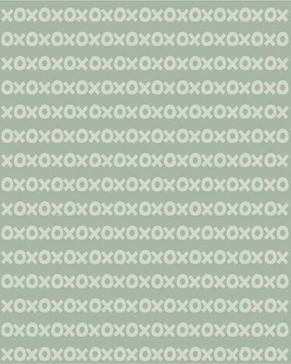 Sur La Mur Montessori wallpaper for playroom in green with a playful X and O pattern