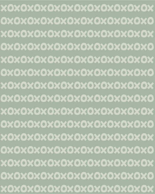 Sur La Mur Montessori wallpaper for playroom in green with a playful X and O pattern