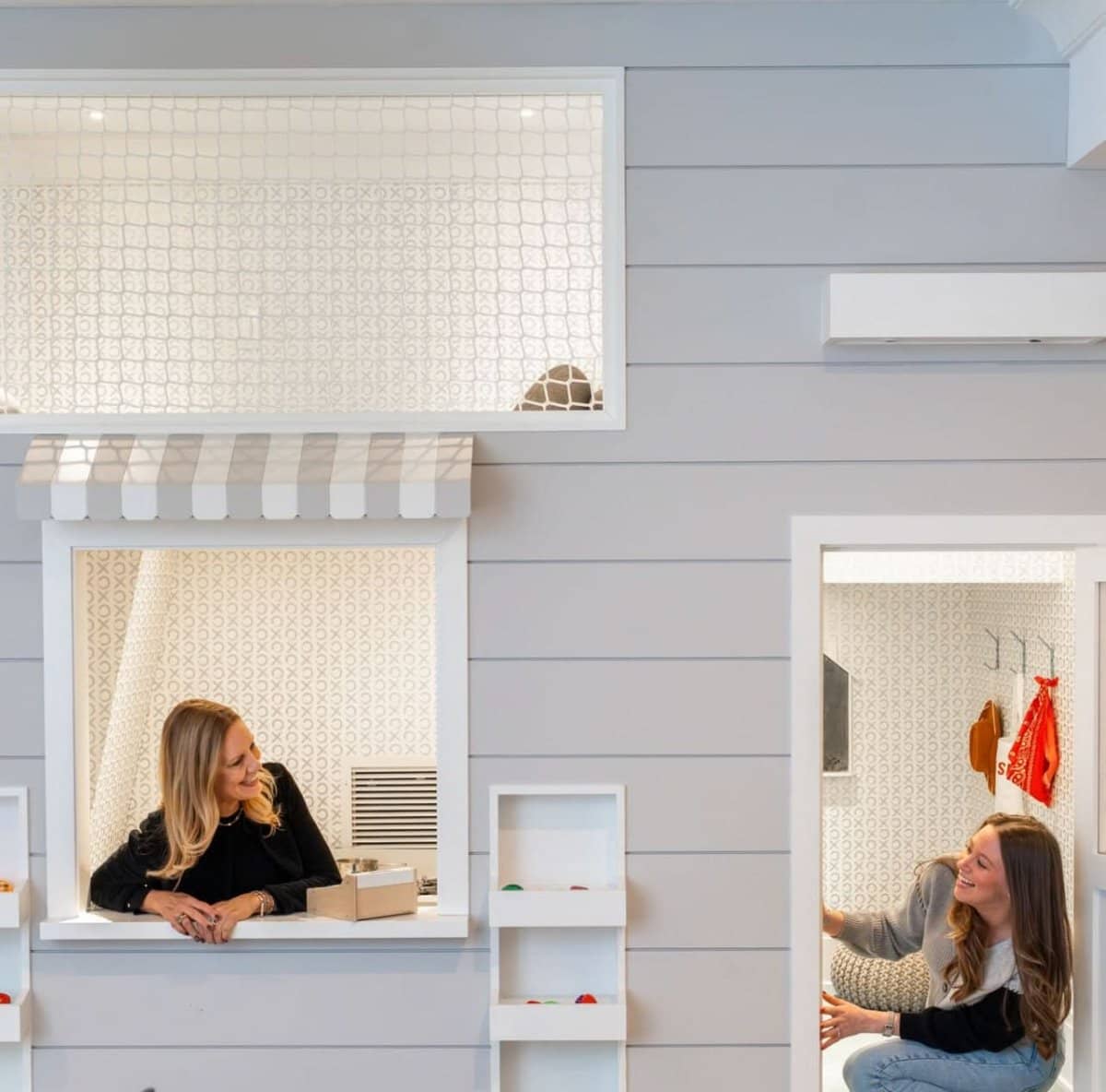 Professionals conducting a playroom design consultation in a stylish playroom setting