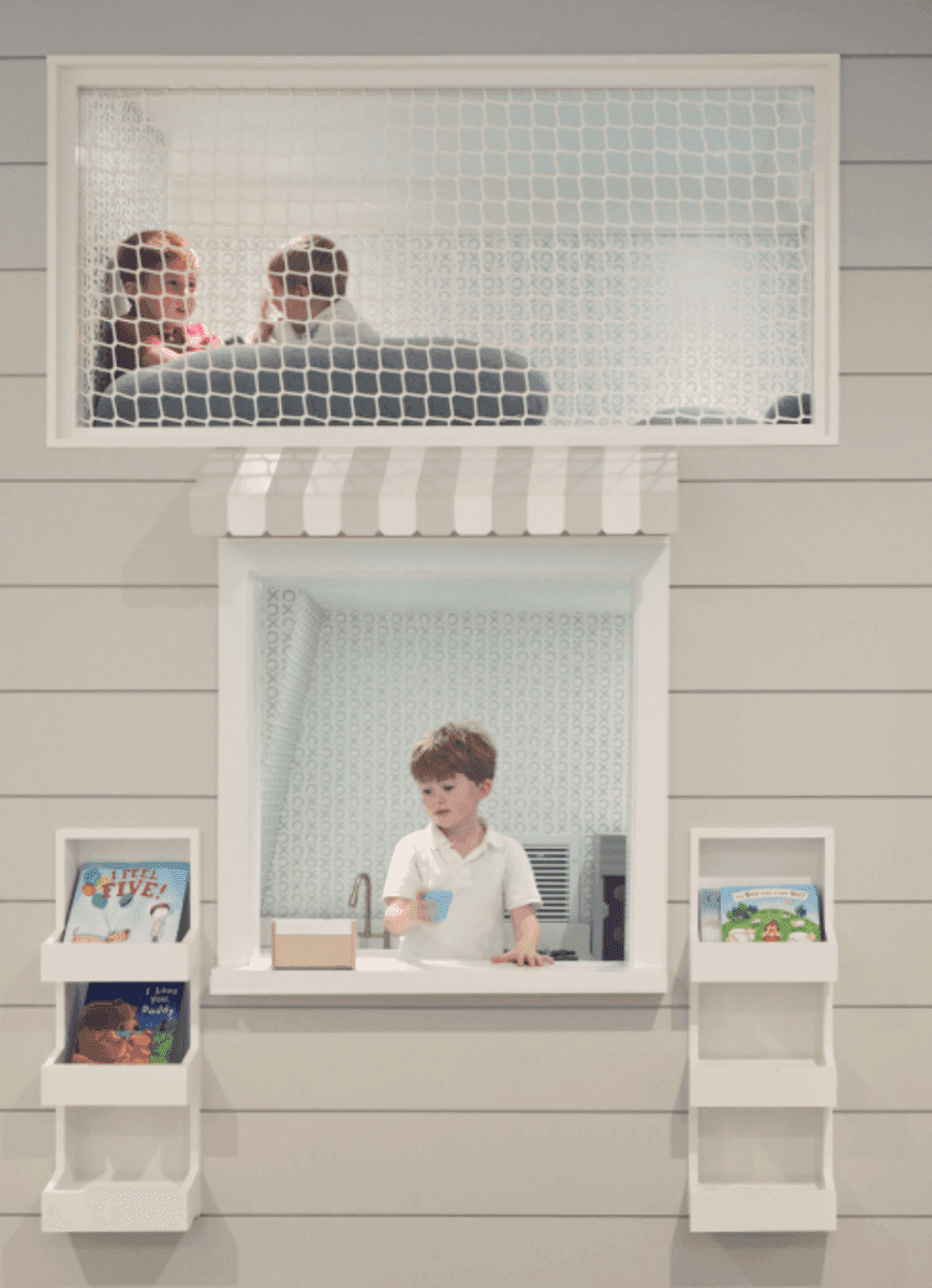 Playroom hammock net set installed in a cozy playroom with children playing and reading