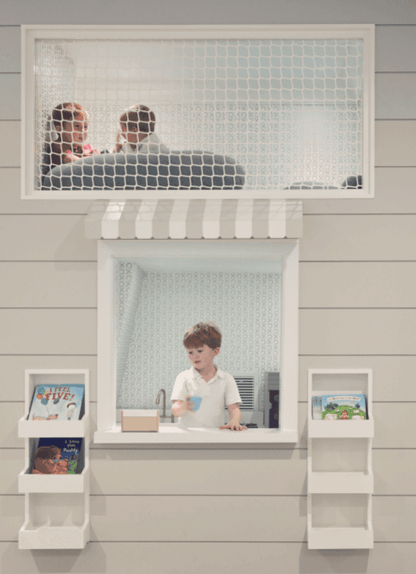 Playroom hammock net set installed in a cozy playroom with children playing and reading