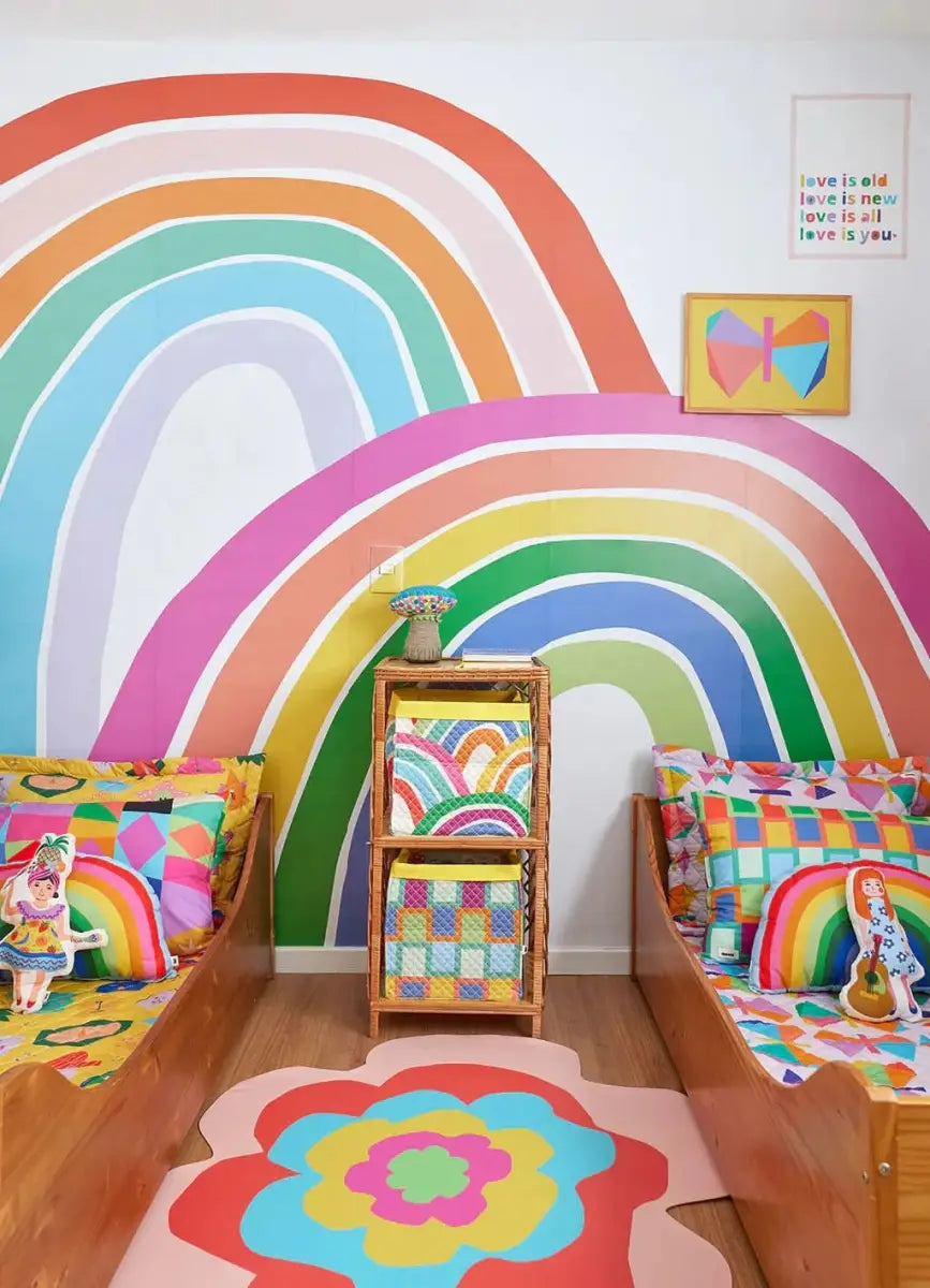 Colorful rainbow wallpaper for playroom featuring vibrant arch designs and cheerful decor