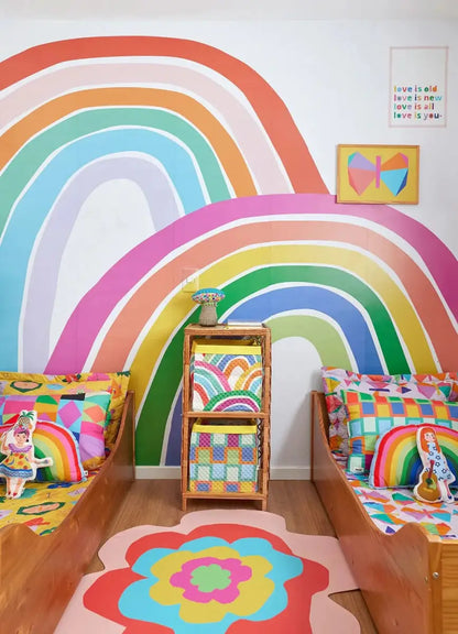 Colorful rainbow wallpaper for playroom featuring vibrant arch designs and cheerful decor