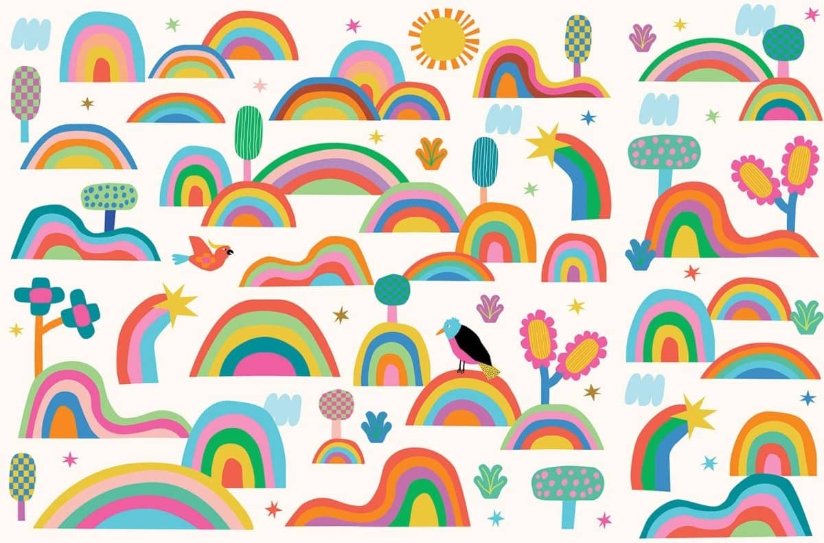 Colorful MOOUI rainbow wallpaper for playroom featuring whimsical trees and playful designs