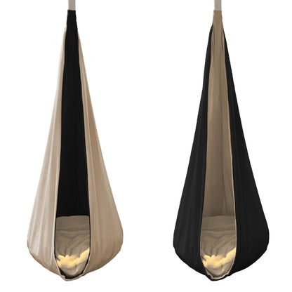 Reversible hanging cocoon swing for kids in beige and black fabric design for indoor or outdoor play.