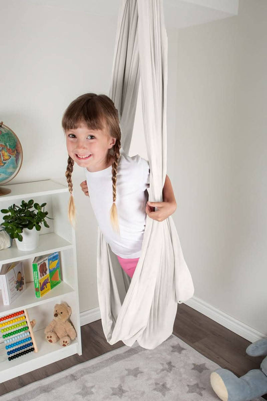 SAVOIZ sensory swing for kids featuring a comfortable and cozy design for indoor play