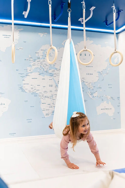 SAVOIZ sensory swing for kids designed for play and relaxation in a colorful room