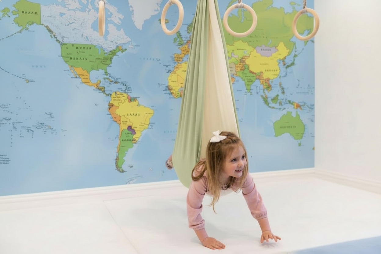 SAVOIZ sensory swing for kids in a playful indoor setting with a child exploring it