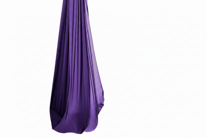 SAVOIZ sensory swing for kids in purple with a smiling child enjoying swinging safely