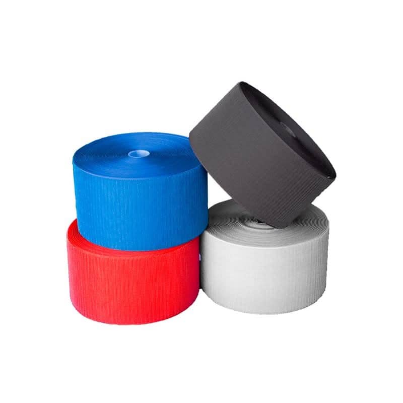 Rolls of Velcro tape for carpet mats in red, blue, black, and white for secure flooring solutions