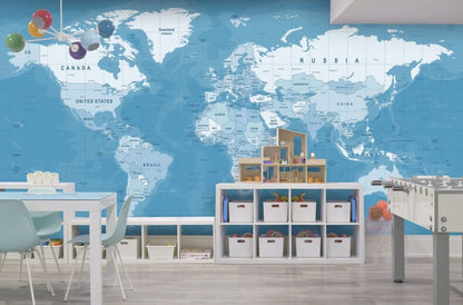 Cara Saven world map wallpaper for playroom featuring a blue background and labeled countries