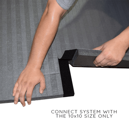 Dollamur carpet texture floor mat for playroom being connected with a hand showing the interlocking system