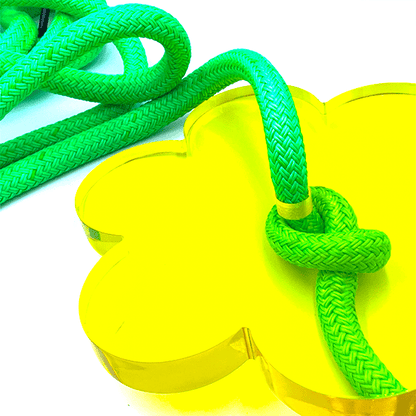 Bright yellow designer flower swing for kids with vibrant green ropes for outdoor fun